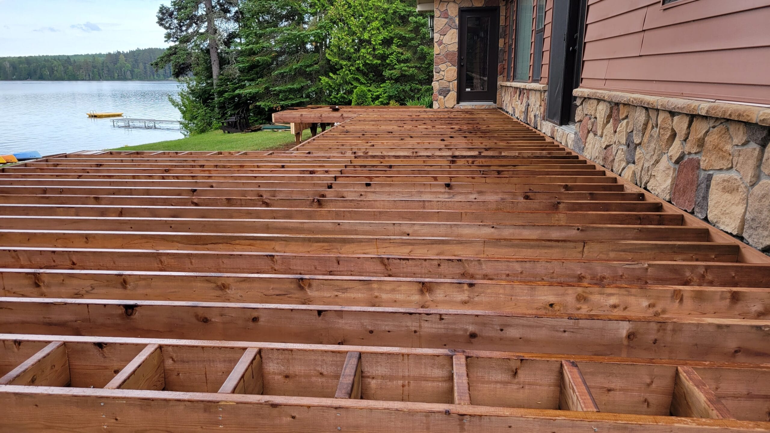 Wooden deck construction with lake view